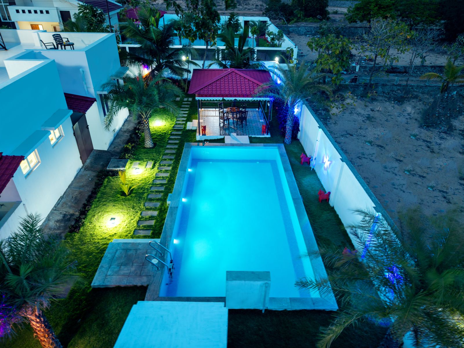 Jasmine Villa pool at night, aerial view